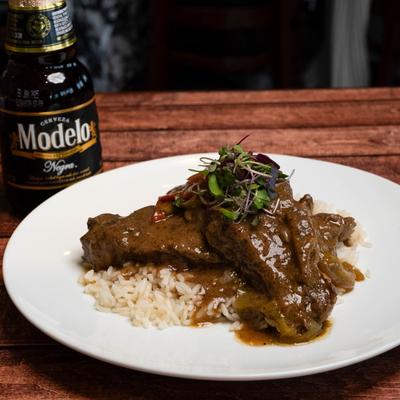 Smothered pork chops, served.