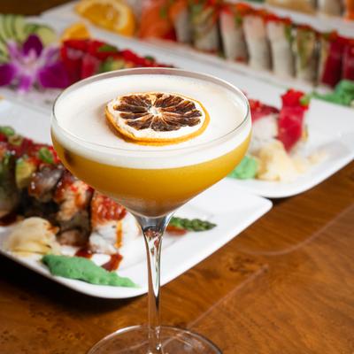 Happy Ending cocktail with sushi rolls.