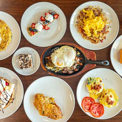 Overhead view of assorted brunch dishes.