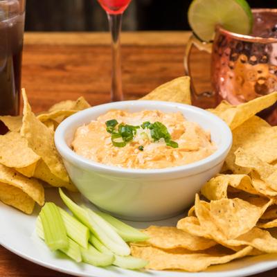 Buffalo chicken dip, chips and cocktails
