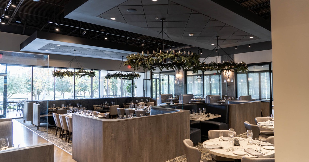 Interior, booths with set tables ready to receive guests
