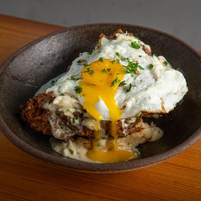 Couyon Daddy dish with chicken, creole crab dip, egg and biscuit