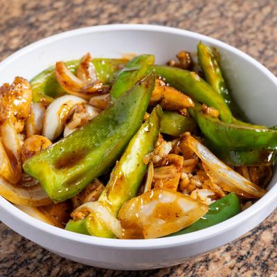 Steak rice bowl, with grilled peppers and onions.