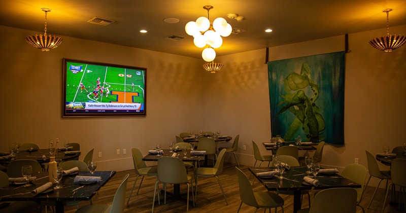 Cozy interior dining area with dining tables set for guests