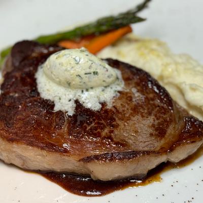 Brandt Beef Ribeye, mashed potatoes, fried Brussels sprouts, compound butter.