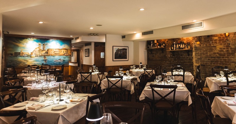 Interior, dining area with set tables for guests