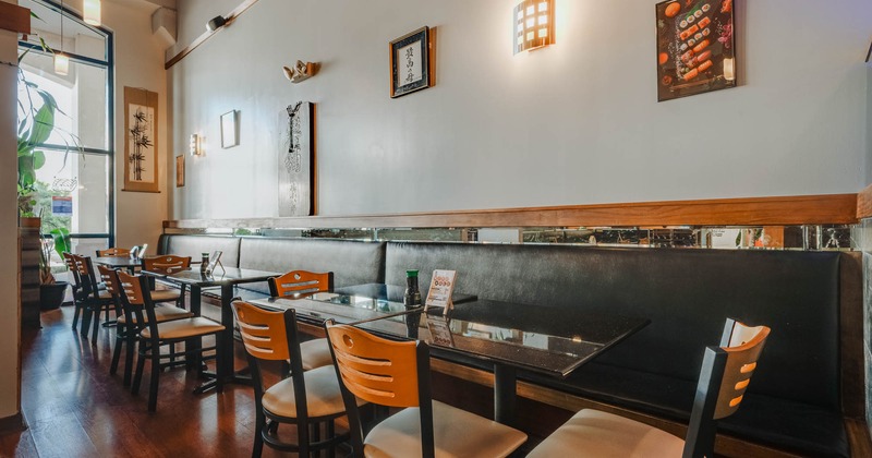 Interior, seating area with tables, chairs and leather banquette seating