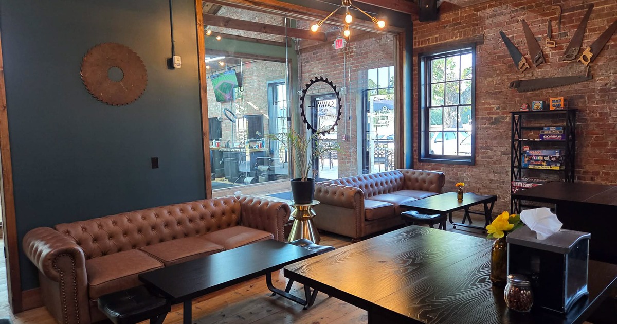 Cozy and rustic lounge area with comfortable upholstered sofas and wooden coffee tables