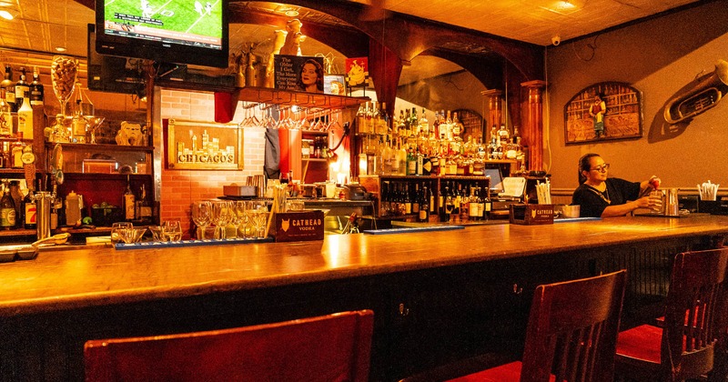 Bar, chairs, bar rack behind