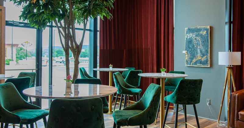 Interior, bar tables and upholstered bar chairs