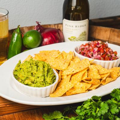 House made Pico De Gallo and Guacamole, accompanied with raw vegetables, wine and beer.