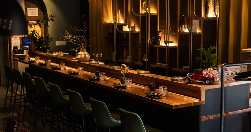Diner table line, chairs, chandeliers