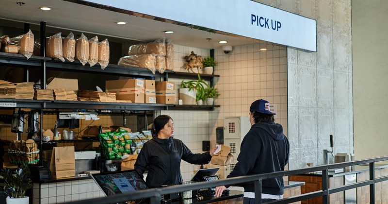 Employee serving a customer