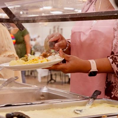 Person at the at the self-service food counter.