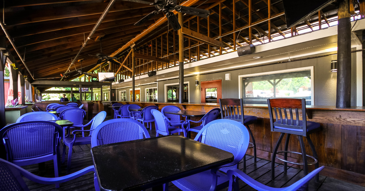 Outdoor seating area with blue chairs