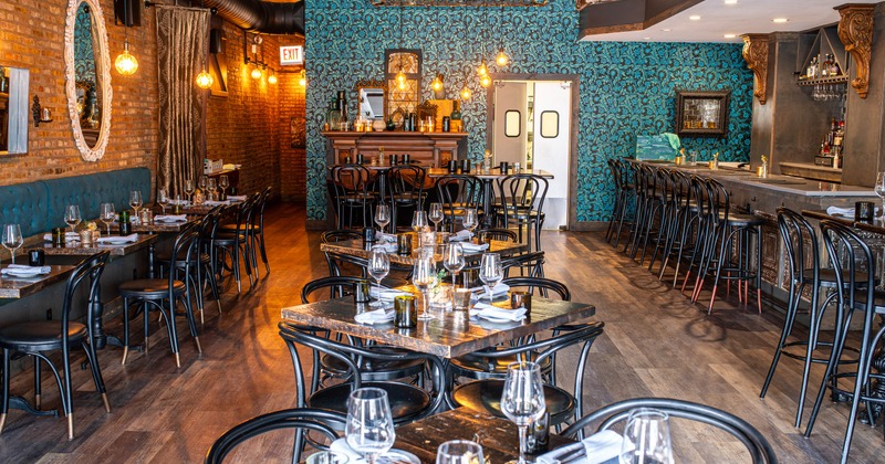 Interior, dining area with tables set for guests