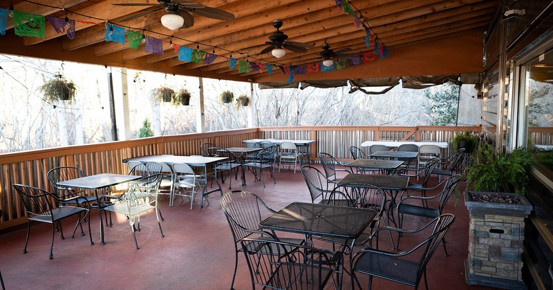 Covered patio with tables and chairs