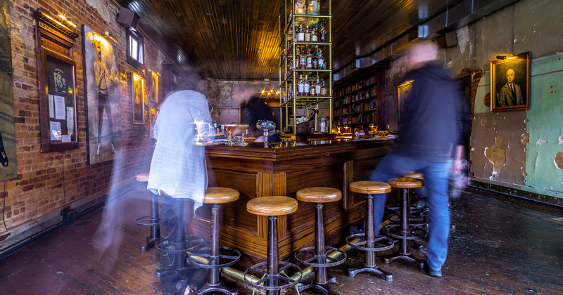 Interior, guests at the bar counter