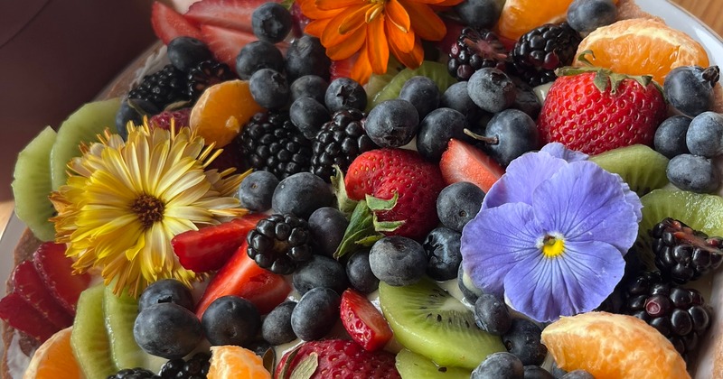 Fresh summer fruits tart over vanilla custard in a hand made crust.
