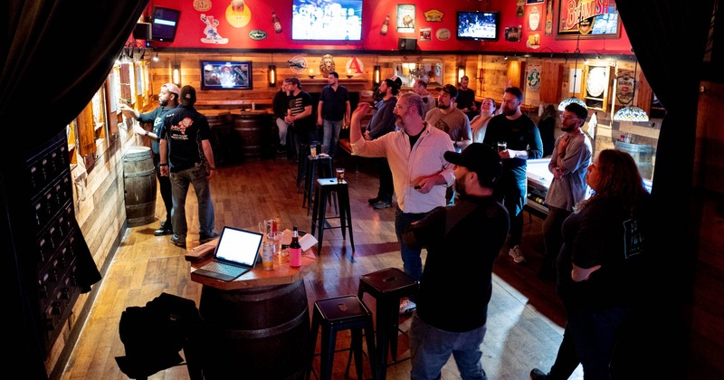 Customers playing darts