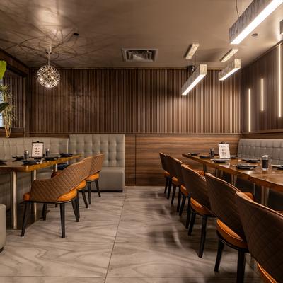 Dining area, booths and banquette seating with tables ready for dining.