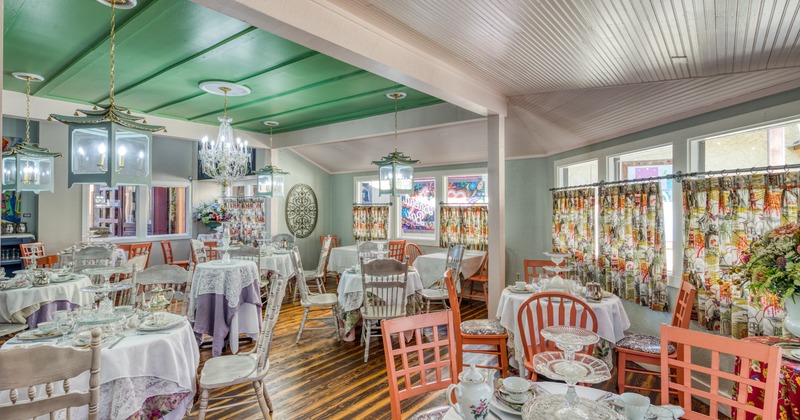 Interior, floral decor design, skirted tables with table items