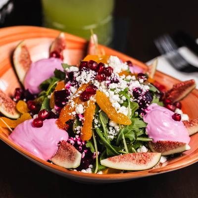 Goddess Fig Salad served with house dressing and goat cheese.