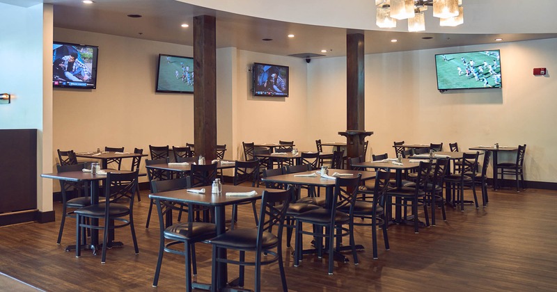 Interior, seating space, big screens on the wall