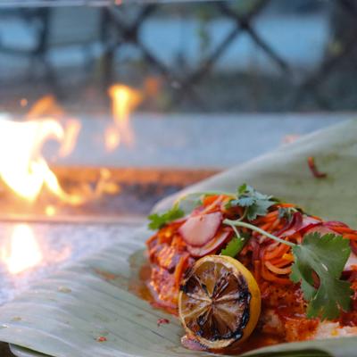 Haddock in achiote adobo served on a banana leaf.