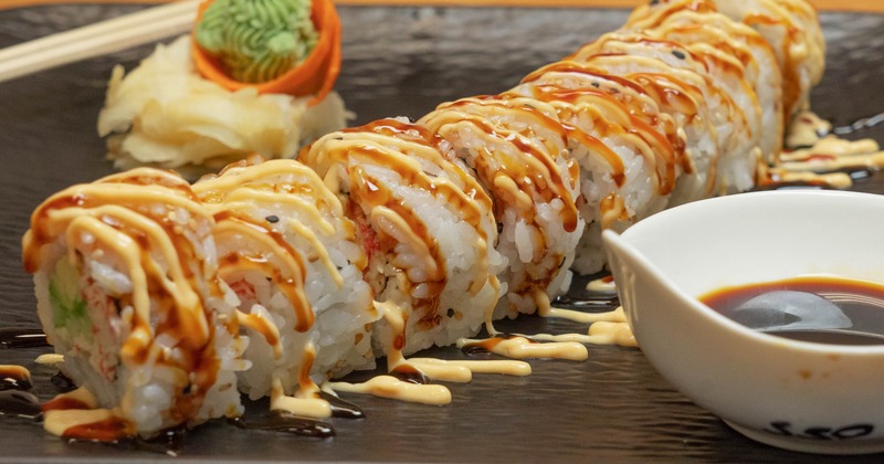 Crab meat and avocado sushi rolls with spicy sauce