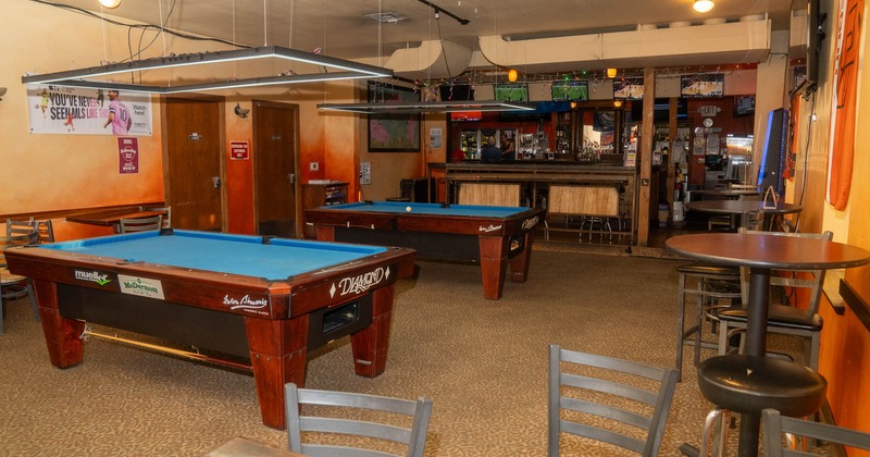 Interior, seating area with a pool tables in the middle