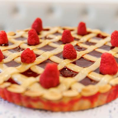 Raspberry lattice pie with almond topping.