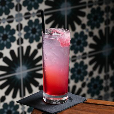 Crimson and Soda cocktail in a highball glass.