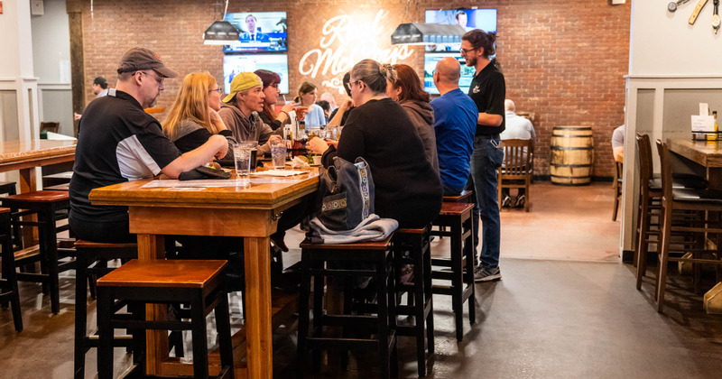 Interior, seating area with guests and staff