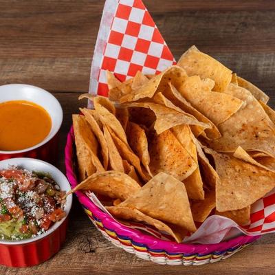 Chips salsa and guacamole with side of pico and salsa.
