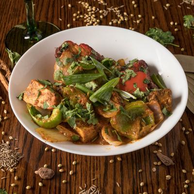 Assorted tandoor-baked chicken and lamb kabobs in a bowl.
