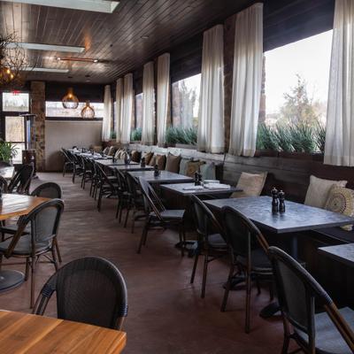 Interior, banquette seating, tables and chairs.