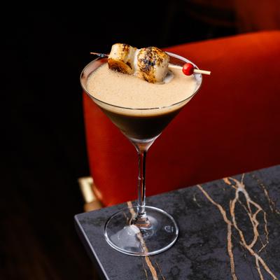 Espresso martini garnished with toasted marshmallows.