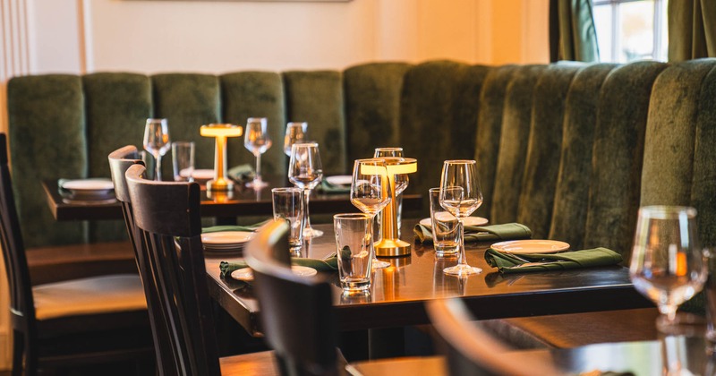 Interior, table set for guests in dining area