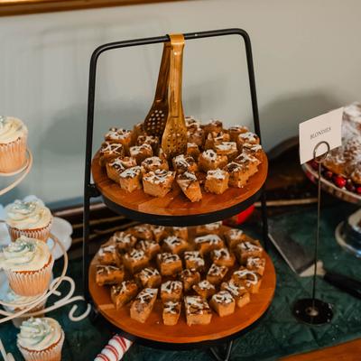 Interior, sweet treat stands displayed on a table.