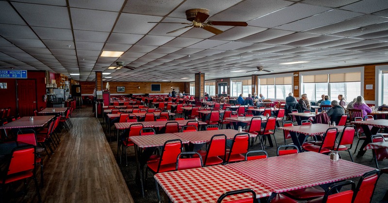 Interior, main dining area with tables and chairs ready for guests