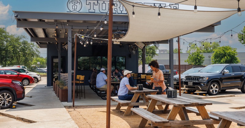 Covered patio with tables and benches