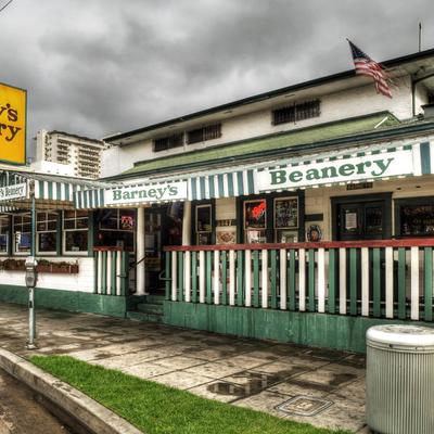 Exterior, the diner with a nostalgic feel, green-striped awnings, and a vintage sign