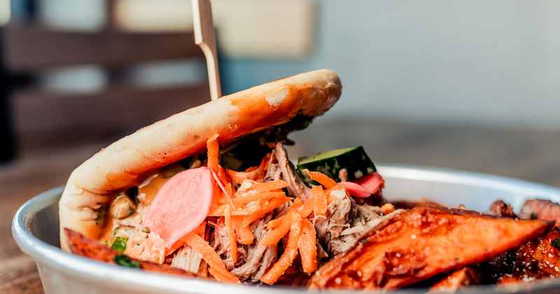 Pastry with grilled sliced meat and salad