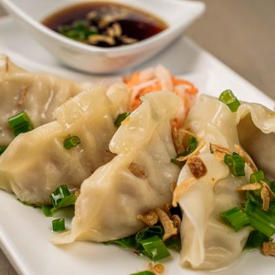 Steamed dumplings with soy sauce.