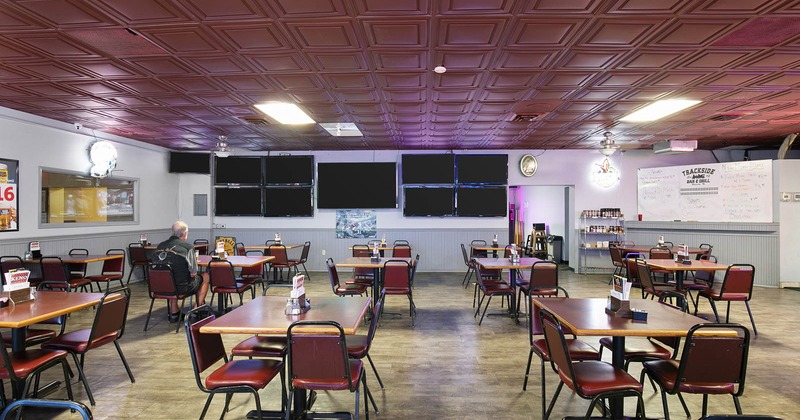 Seating area with large TV screens on the wall