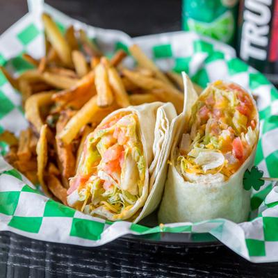 Grilled chicken wrap, served with fries.