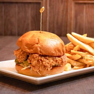 A hot chicken sandwich and French fries.