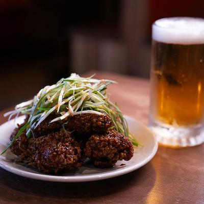 Soy Spring Onion Chicken with a glass of beer.