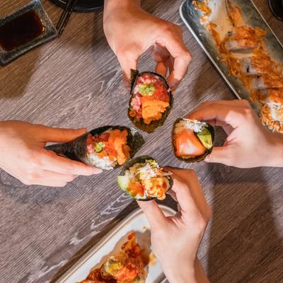 Customers having hand rolls.